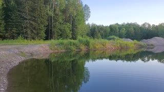 Tranquil night with water and setting sun