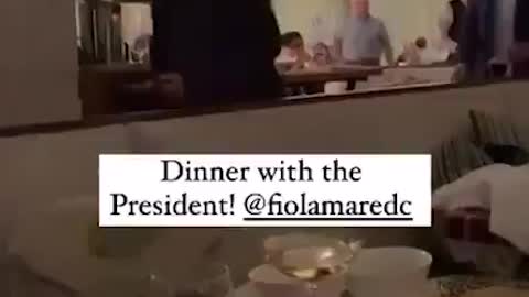 Joe Biden walks through a Washington, D.C. restaurant without a mask, violating D.C.'s mask mandate.