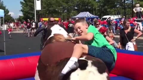 This Funny Mechanical Bull Fails - Better hold on tight! haha