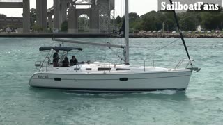 Rafiki Sailboat Cruising Up St Clair River In Great Lakes