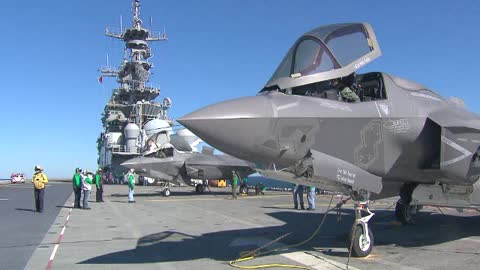 Package of F-35's taking off and landing from a carrier at sea.