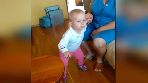 Adorable baby wabbles hips to nursery rhymes