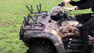 Man on camouflage motorcycle flips over slow motion
