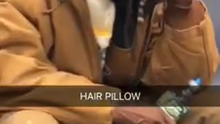 Hair pillow man in brown leans head agains handful of hair