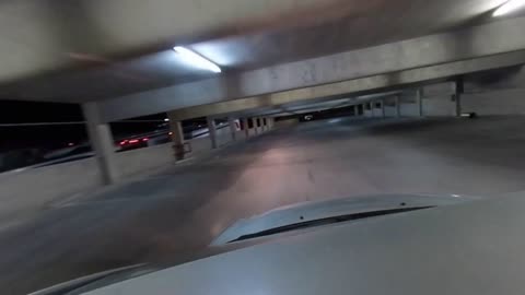 Relaxing Drive Inside 6 Story Parking Structure at Night with Distant Las Vegas Lights