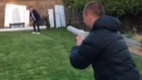 Batter gets hit head by potato gun, falls down