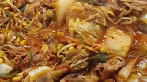 Korean beef yukhoe, yukhoe bibimbap, and miso stew at a Korean restaurant