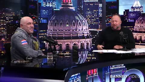 Alex Jones Gives Joe Rogan A Gun