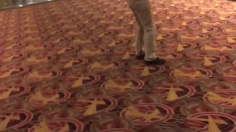 Guy black shirt khaki jeans backflip movie theater fail