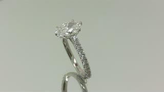An oval Diamond set in a custom engagement ring.