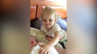 Toddler Girl Wipes Sneeze On Baby Sibling