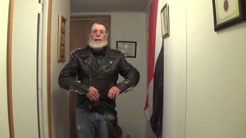 Spiked leather jacket over a leather shirt