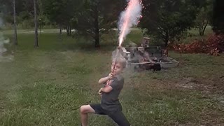 Kid with Roman Candle Takes Out Camera