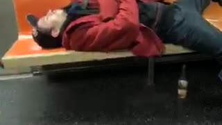 Drunk man passed out on subway train, takes up 4 seats