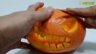 Halloween pumpkin carving art.