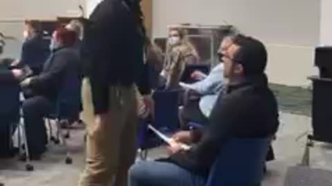 Security Guard aggressively drags maskless man out of New York school board meeting