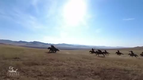 Traditional Mongolian Cavalry performing Horse back Archery