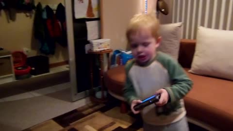 Toddler makes angry face when he dances