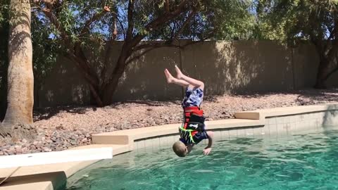 4-year-old conquers fear of diving boards, does back flip into pool