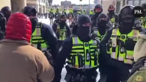 Canadian Police Beat Peaceful Protester with Butt of a Rifle