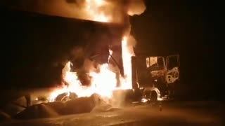 Trucks in flames.