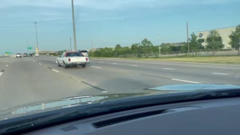 Texas Longhorn car on Interstate 30