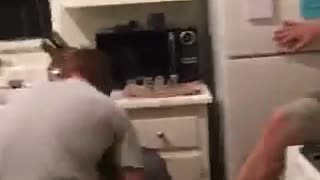 Guy slams friend into stove