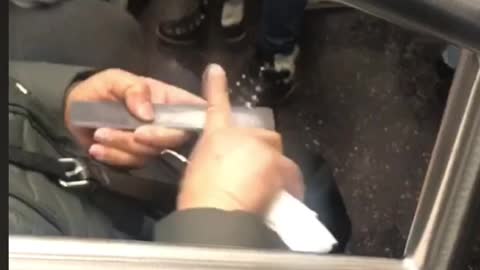 Woman files her index finger with nail filer on subway train
