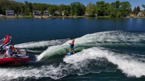 MasterCraft wake boarding from drone view