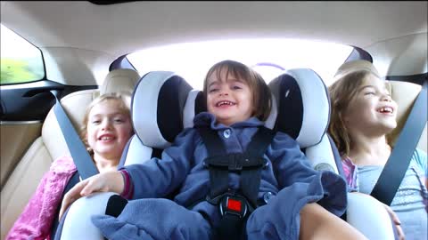 Kids riding in Tesla Model S
