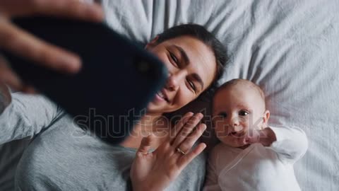 neo mother and her newborn baby making a selfie