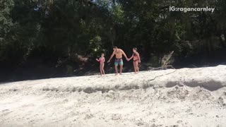 Dad runs into the oceans with two daughters, one falls and scorpions into water