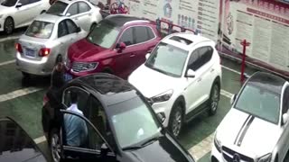 Woman Pushes Car After Accidental Reverse Gear