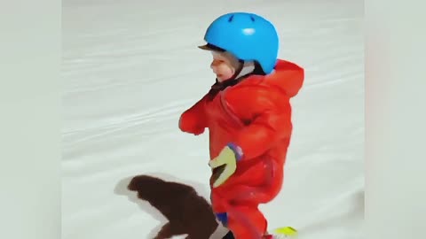 Adorable one year old baby enjoying in the snow ice. And his expression is so cute