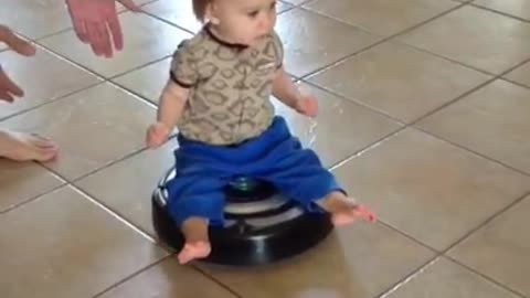Baby riding a roomba - starring lex mubarak
