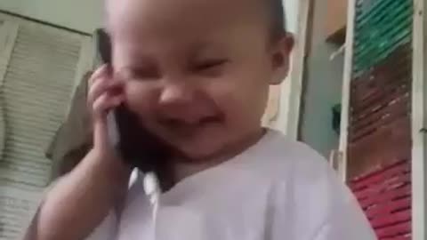 Cute Baby Pretends To Talk On The Phone! Seems Serious! Lol.