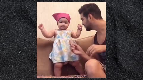 Little Arab Cute Kid enjoying dancing with her Dad
