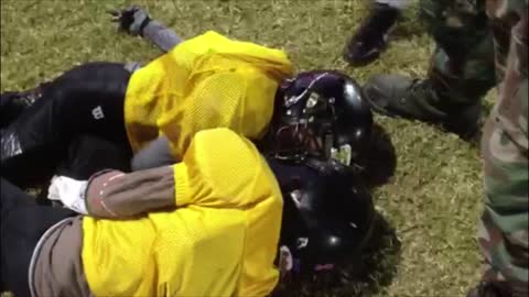 Pee Wee Football Kids Get Masks Stuck Together During Drill