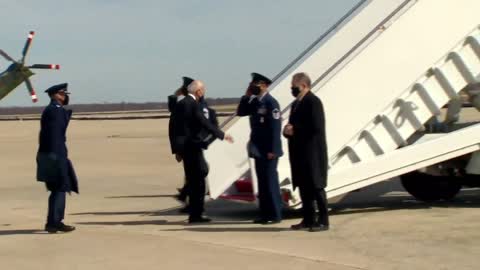 Joe Biden falling three times while boarding Airforce One