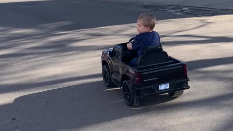 Baby Leo driving Chevy Silverado