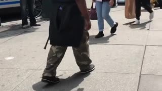 New york legend birdman walks around sidewalk