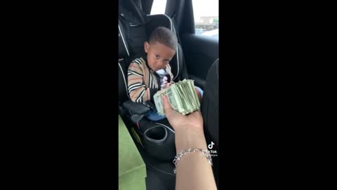 This baby stopped crying after seeing Money