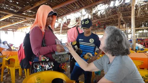 Chacala Beach Mexico! Akaisha buys earrings from beach vendor