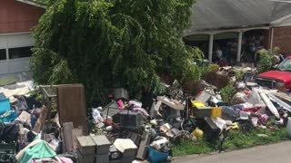 House Blocked by Mountain of Junk