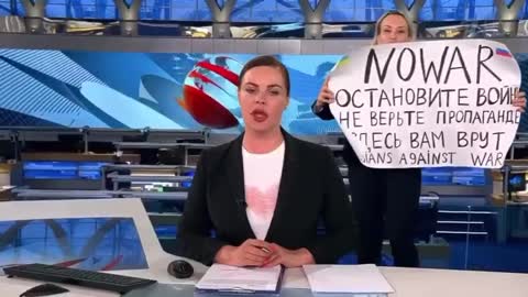 Russia's 'Channel One' editor appeared behind the news host with the "NO WAR" poster