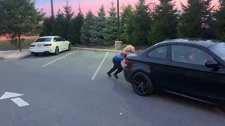 Spanish lady pushes car