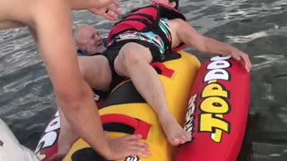 Couple Struggle to Board Hotdog Tube