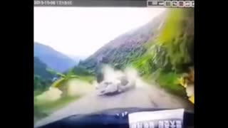 Driver Survives As Falling Boulder Crushes Car