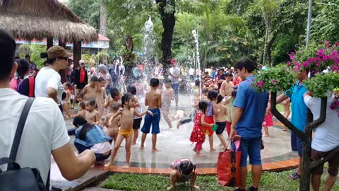 The children enjoy bathing in the Zoo of Ho Chi Minh City, Viet Nam