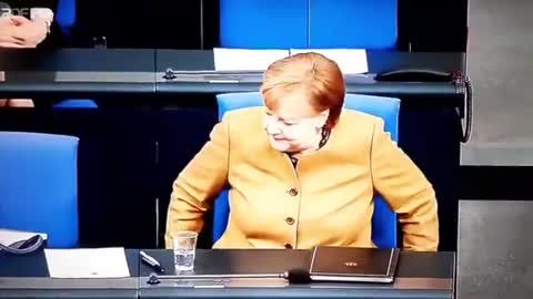 GERMAN CHANCELLOR ANGELA MERKEL SEEMINGLY 'FORGETTING' TO PUT HER MASK ON